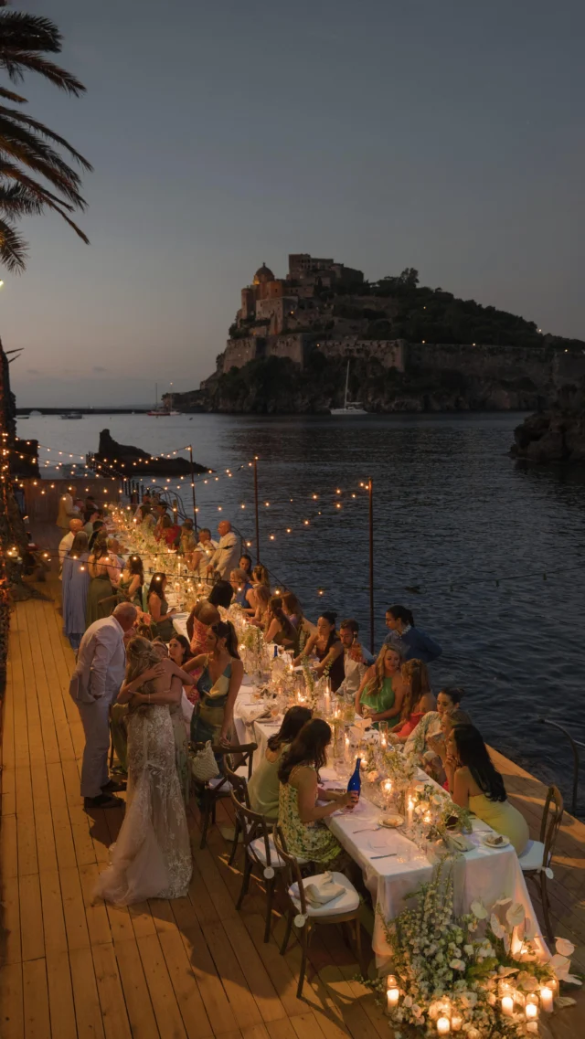 Buonasera, Signorina…
and welcome to a truly Italian wedding night! 🍽️✨
Fairy lights, Italian food, the sea breeze, and the fazzoletto dance with Castello Aragonese in the background 🌊
everything was just perfetto! 👌🏻

And you don’t need to be Italian to feel it : 
our traditions make everyone part of the story 🤌🏻🤍

Wedding planner : @esterchianelli_iwa
Venue: @edenischia 
Content : @andy.nasta.wedding @andy.nasta @raffaellaferrigno 
Lights & music : @servicesco_events
Arrangements : @magno_allestimenti
Make-up : @beautylivery
Stationery : @paigenco
Welcome sign : @crumandco
Celebrant : @iole_celebrant
Florist : @primulaischia
Music : @matt_west_music
Bride : @itsjadeenglish
Photographer :
@elinadavis.photography
Videomaker : @innarhuntsfilms

\\ WHATEVER YOUR HEART DESIRES, WE’LL MAKE IT HAPPEN \\

|| Ester Chianelli Italian Wed Agency ||

📱3806966342
💻 www.esterchianelli.com
📧 info@esterchianelli.com 

#italianwedding  #italywedding #ischia #destinationweddingitaly
#destinationwedding #weddingvenue
#weddinginspiration 
#weddingvenue #italianweddingplanner